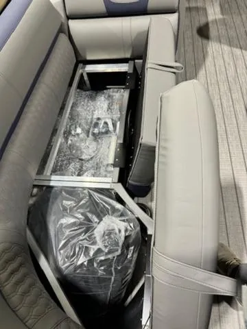Slide: The Image of 2024 Avalon Catalina Rear J Lounger interior with gray seating and flooring. - 29