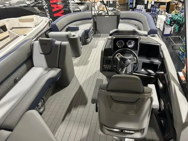 Slide: The Image of 2024 Avalon Catalina Rear J Lounger 23 FT interior with seating and storage. - 36