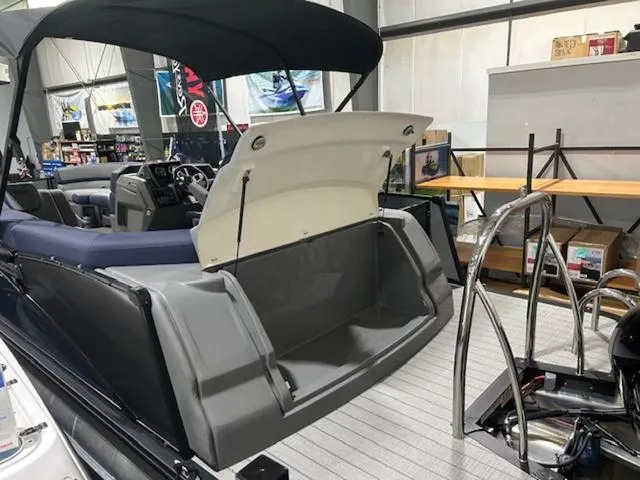 Slide: The Image of 2024 Avalon Catalina Rear J Lounger 23 FT boat interior with plush seating and modern design. - 38