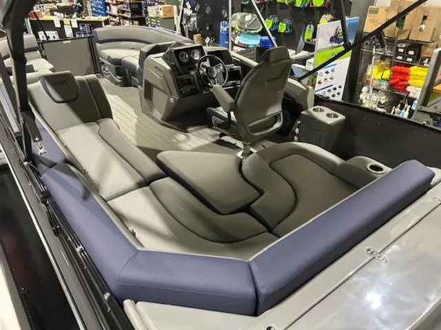 Slide: The Image of 2024 Avalon Catalina Rear J Lounger 23 FT pontoon boat interior with modern seating and helm. - 39