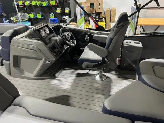 Slide: The Image of 2024 Avalon Catalina Rear J Lounger 23 FT interior with modern seating and controls. - 40