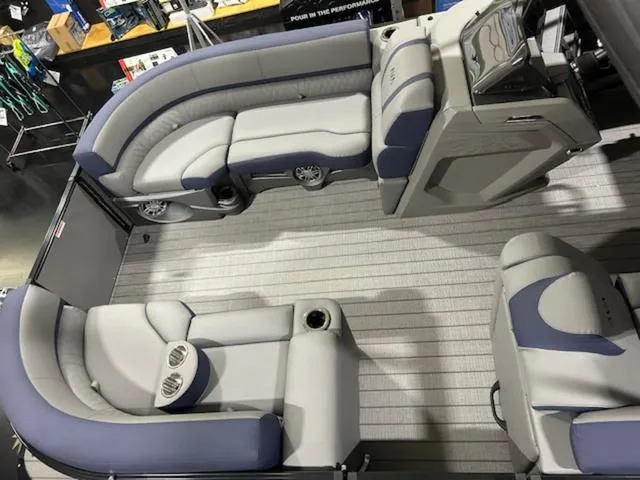 Slide: The Image of 2024 Avalon Catalina Rear J Lounger 23 FT boat interior with open storage compartment. - 41