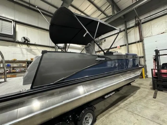 Slide: The Image of 2024 Avalon Catalina Rear J Lounger 23 FT pontoon boat in warehouse. - 8