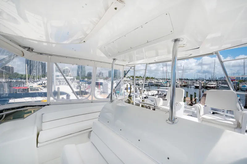 Slide: The Image of Interior view of 1992 Hatteras 50 Convertible yacht at marina. - 15