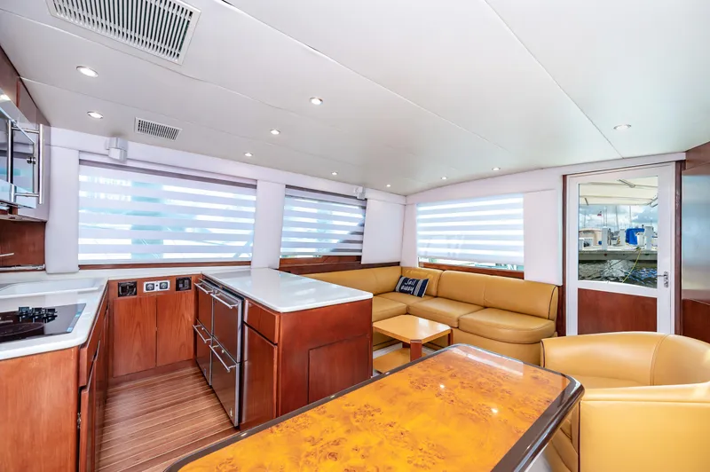 Slide: The Image of Interior of 1992 Hatteras 50 Convertible yacht with modern kitchen and seating area. - 21