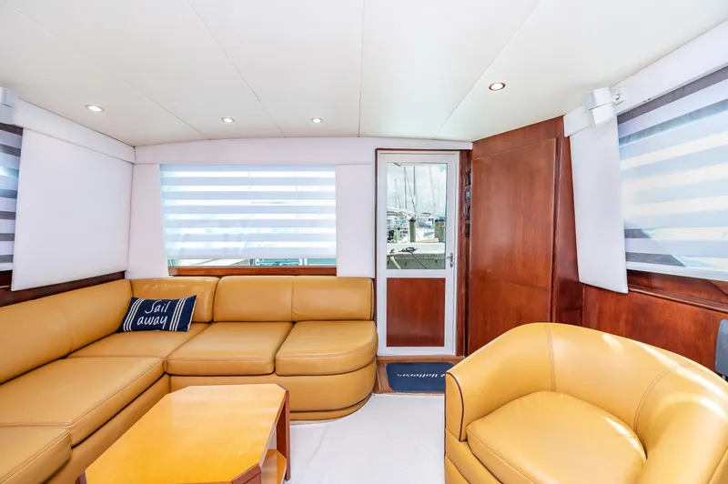 Slide: The Image of Interior of 1992 Hatteras 50 Convertible yacht with leather seating and modern decor. - 22