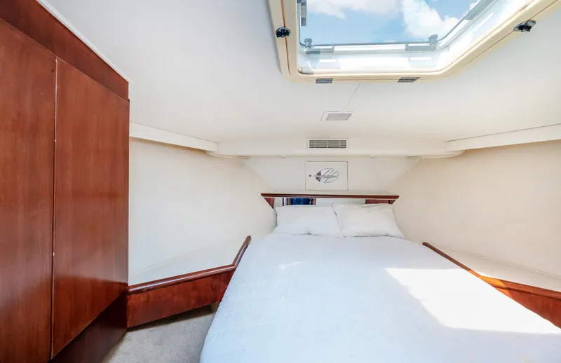 Slide: The Image of Interior cabin of 1992 Hatteras 50 Convertible yacht with skylight and bed. - 28