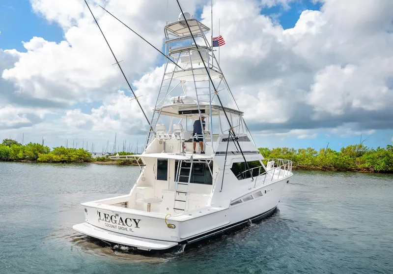 Slide: The Image of 1992 Hatteras 50 Convertible yacht Legacy cruising on a sunny day. - 3