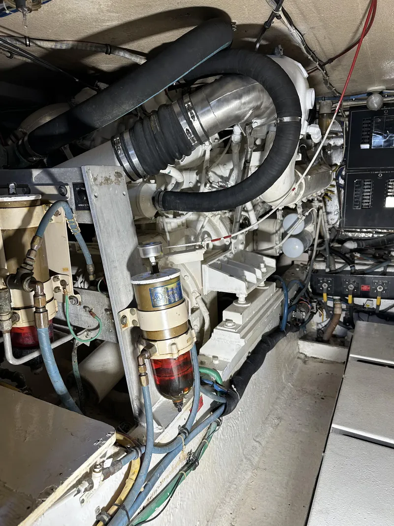 Slide: The Image of Engine room of a 1992 Hatteras 50 Convertible yacht showing mechanical components. - 36