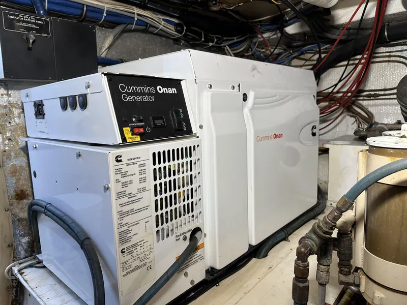 Slide: The Image of Cummins Onan generator in a 1992 Hatteras 50 Convertible engine room. - 39
