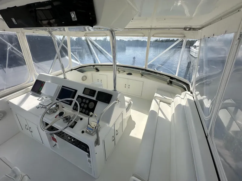 Slide: The Image of 1992 Hatteras 50 Convertible yacht helm station with panoramic water views. - 46