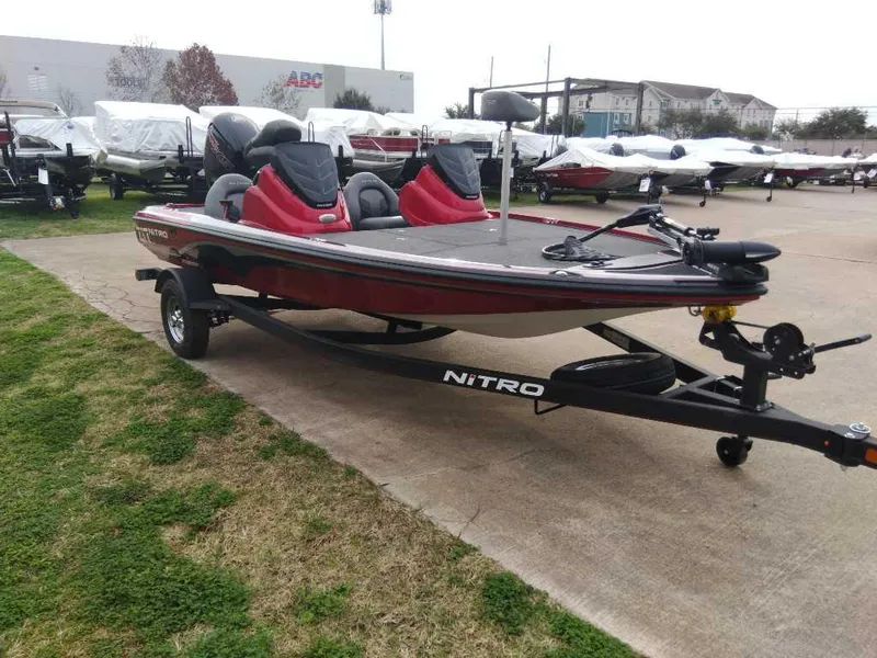 Slide: The Image of 2024 Nitro Z17 fishing boat on trailer in outdoor lot. - 2