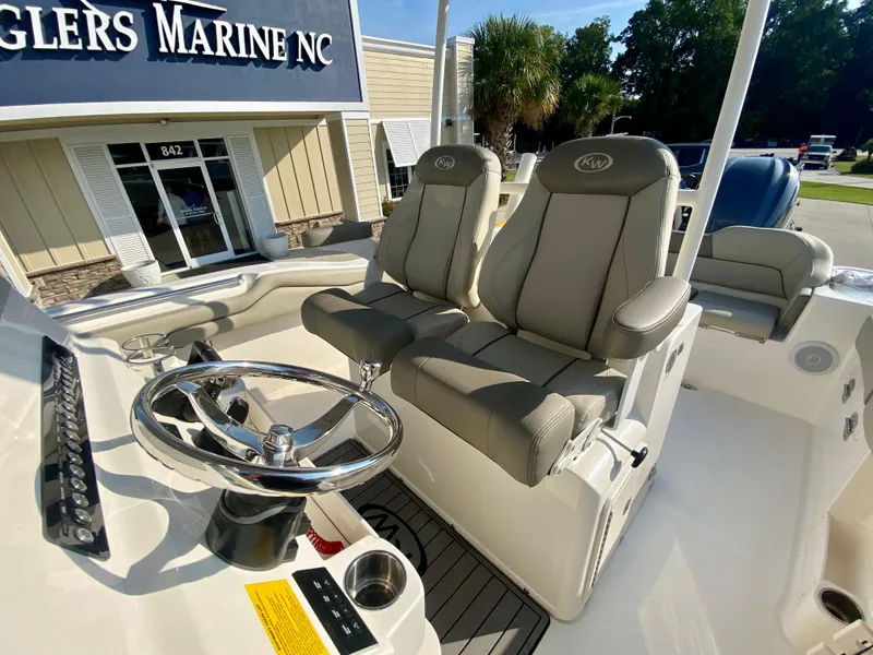 Slide: The Image of 2022 Key West 263 FS boat interior with dual captain's chairs at Anglers Marine NC. - 20