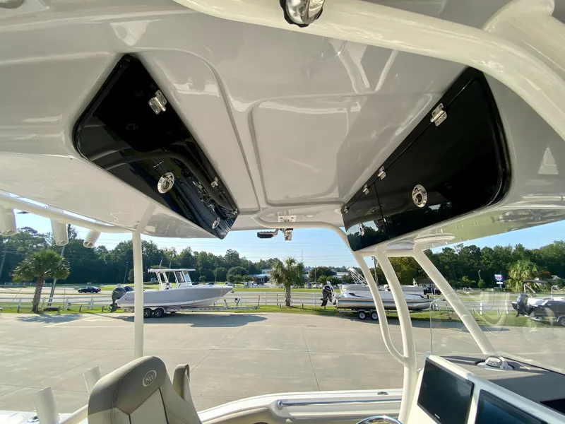 Slide: The Image of 2022 Key West 263 FS boat interior with overhead storage compartments. - 28