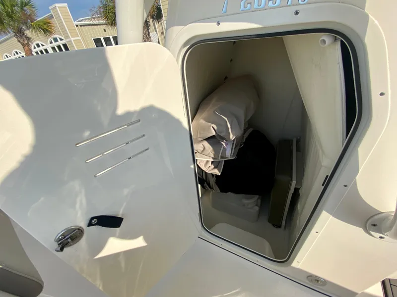 Slide: The Image of 2022 Key West 263 FS storage compartment with open door. - 36