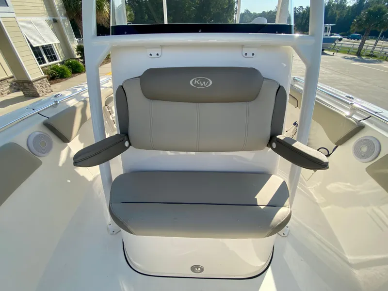 Slide: The Image of 2022 Key West 263 FS boat with cushioned seating and armrests. - 40