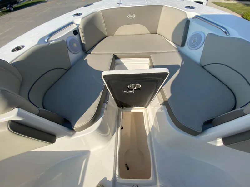 Slide: The Image of 2022 Key West 263 FS boat interior seating and storage compartments. - 42
