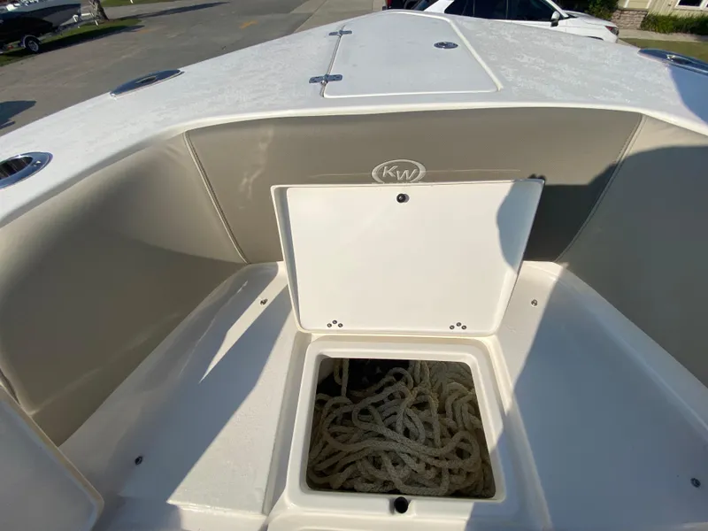 Slide: The Image of 2022 Key West 263 FS boat with open storage compartment containing ropes. - 46