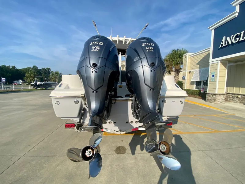 Slide: The Image of 2022 Key West 263 FS boat with twin 250 V6 engines at dealership. - 5