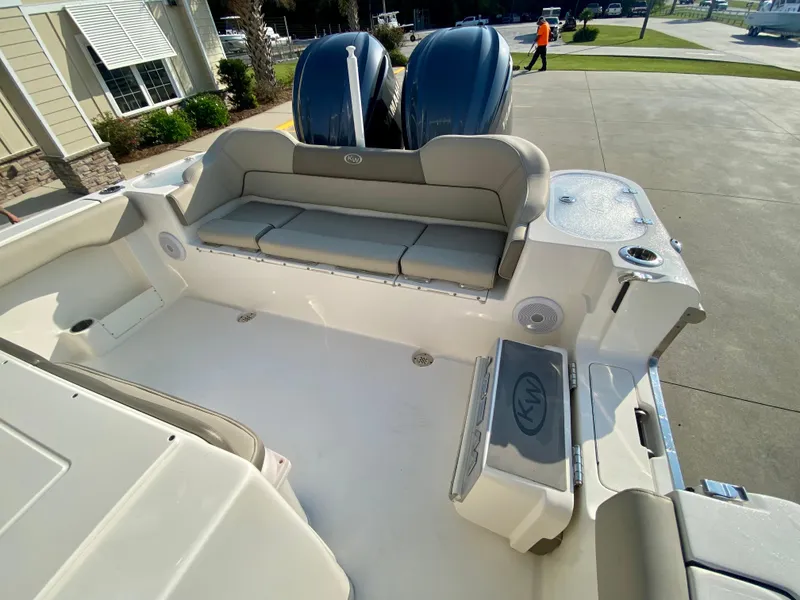 Slide: The Image of 2022 Key West 263 FS boat with twin engines and spacious seating area. - 8