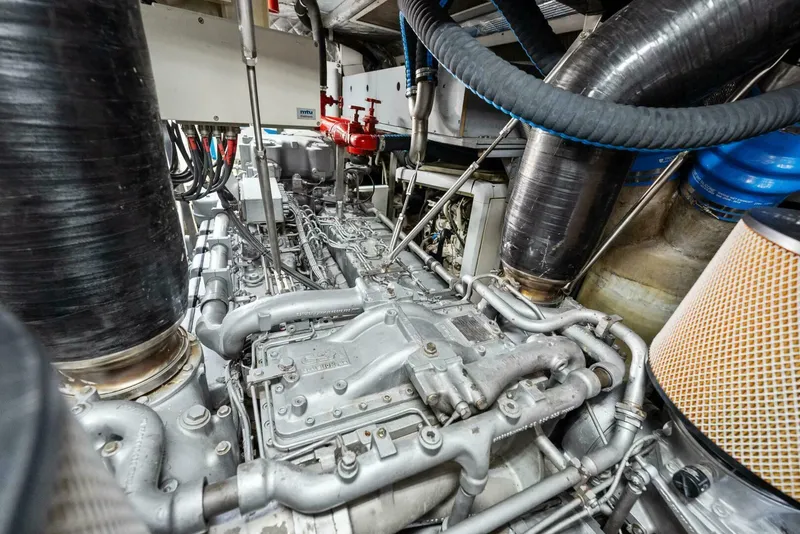 Slide: The Image of Engine room of 2006 Tecnomar 35 Nadara yacht with complex machinery and piping. - 12
