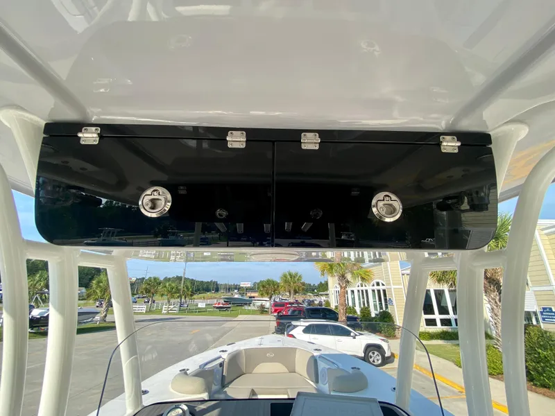 Slide: The Image of 2022 Key West 263 FS boat console with storage compartments. - 30