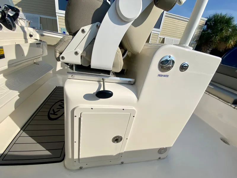 Slide: The Image of 2022 Key West 263 FS boat interior with seating and storage compartment. - 34