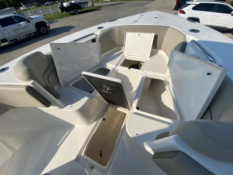 Slide: The Image of 2022 Key West 263 FS boat with open storage compartments. - 48