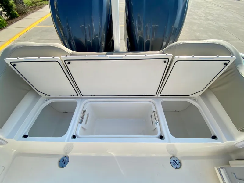 Slide: The Image of 2022 Key West 263 FS boat storage compartments and twin engines. - 11