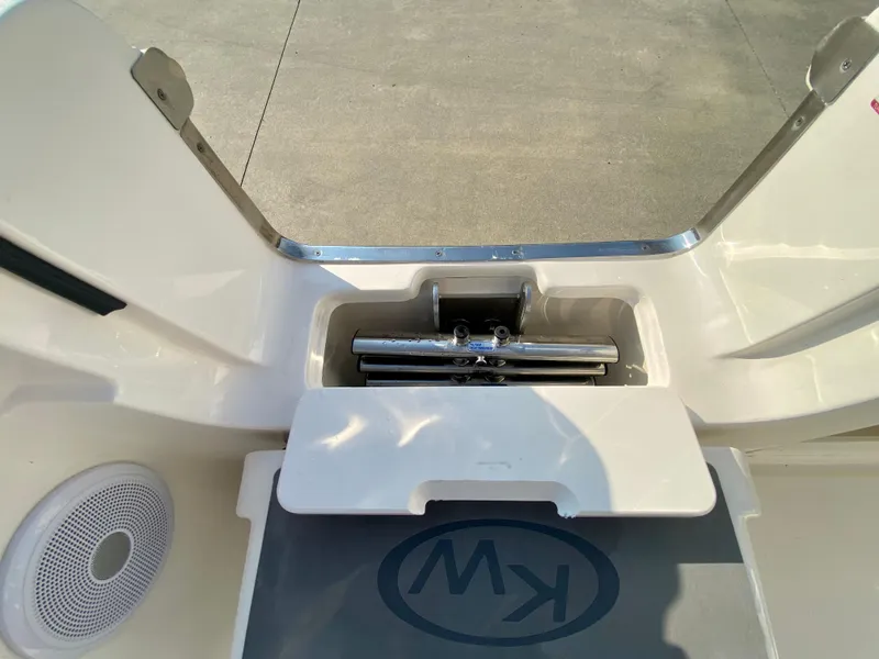 Slide: The Image of 2022 Key West 263 FS boat with storage compartment and speaker. - 16
