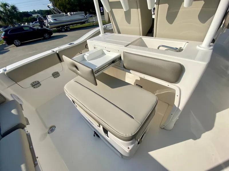 Slide: The Image of 2022 Key West 263 FS boat interior with seating and storage compartments. - 18
