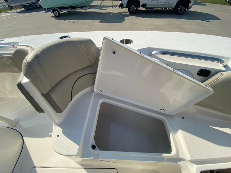 Slide: The Image of 2022 Key West 263 FS boat with open storage compartment and seating. - 45