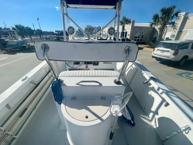 Slide: The Image of 1980 Robalo 2380 boat interior with seating and storage compartments. - 6