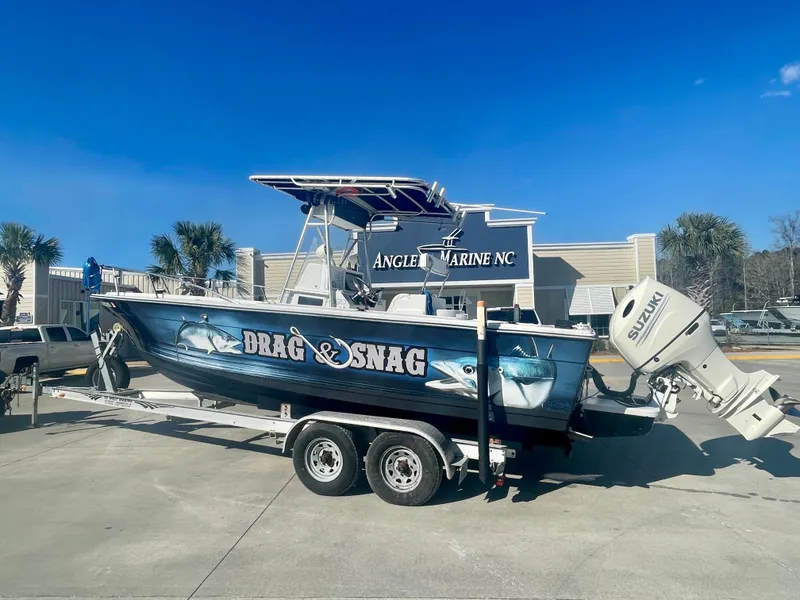 Slide: The Image of 1980 Robalo 2380 fishing boat Drag & Snag on trailer at Angler Marine NC. - 1
