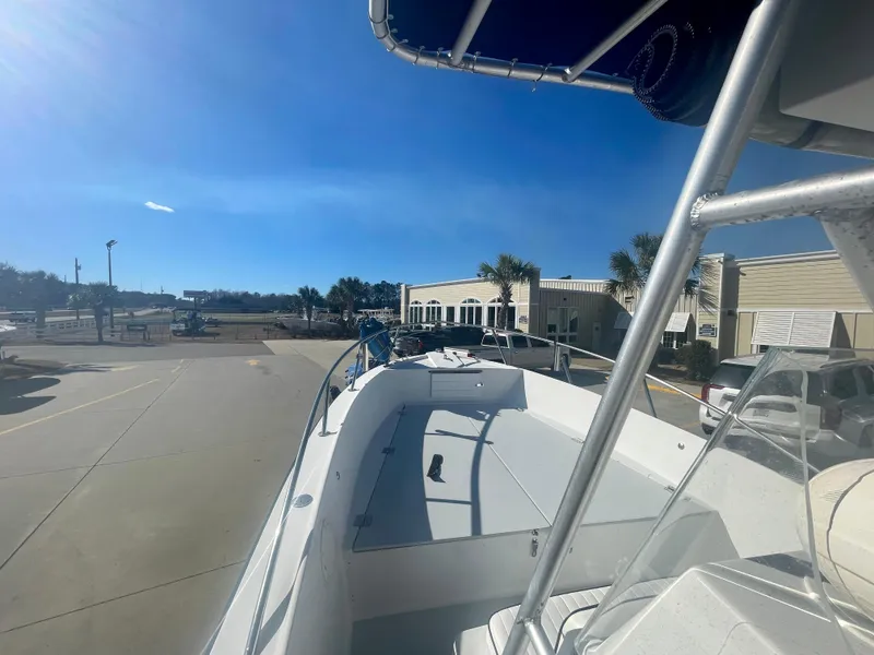 Slide: The Image of 1980 Robalo 2380 boat docked at a marina on a sunny day. - 14