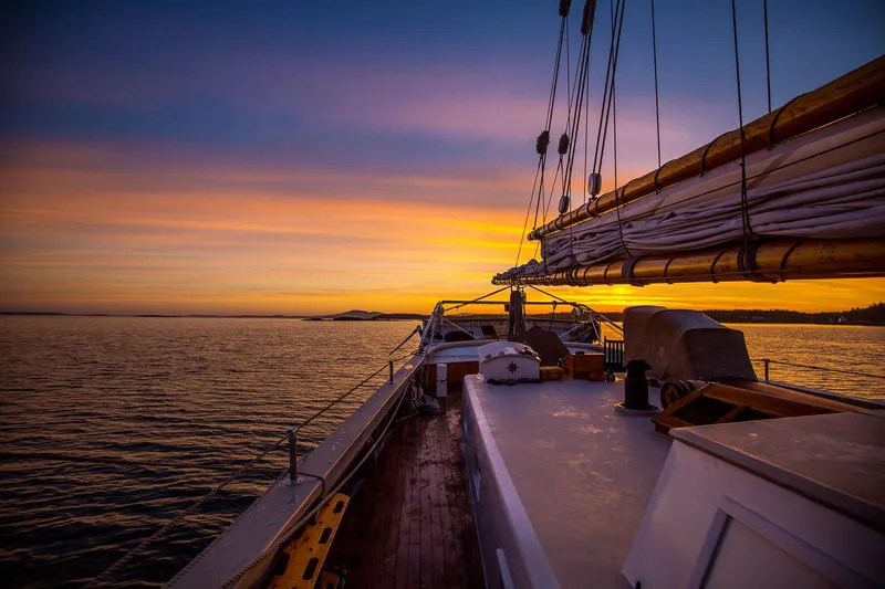 Slide: The Image of 1962 Gamage Coastal Gaff Rigged Schooner sailing at sunset with vibrant sky. - 14