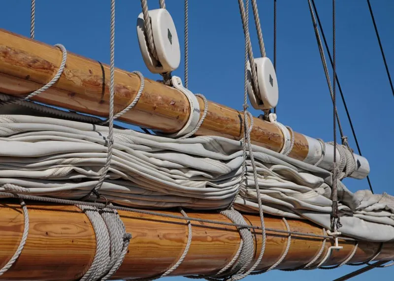 Slide: The Image of Gamage Coastal Gaff Rigged Schooner sails and rigging, 1962, against clear blue sky. - 18