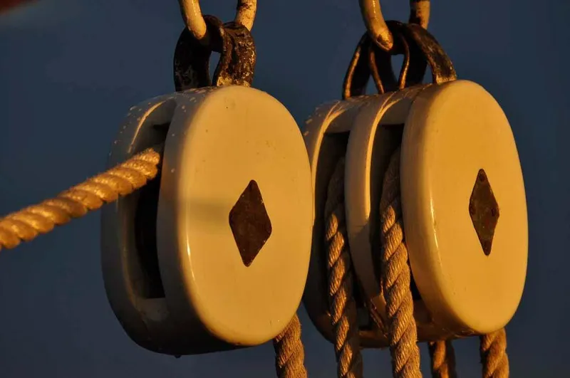 Slide: The Image of Close-up of ropes and pulleys on a 1962 Gamage Coastal Gaff Rigged Schooner. - 22
