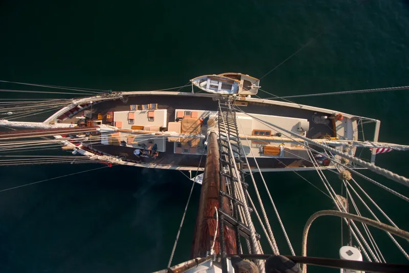 Slide: The Image of Aerial view of 1962 Gamage Coastal Gaff Rigged Schooner on calm water. - 23