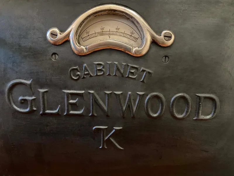 Slide: The Image of Vintage Glenwood K cabinet with ornate gauge and embossed lettering. - 34