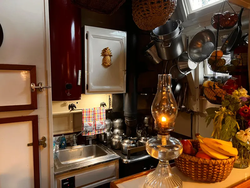Slide: The Image of Cozy kitchen on 1962 Gamage Coastal Gaff Rigged Schooner with vintage decor and fruit basket. - 36