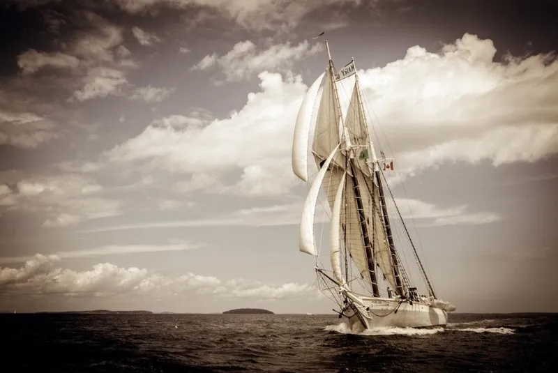 Slide: The Image of Vintage 1962 Gamage Coastal Gaff Rigged Schooner sailing under cloudy skies. - 6