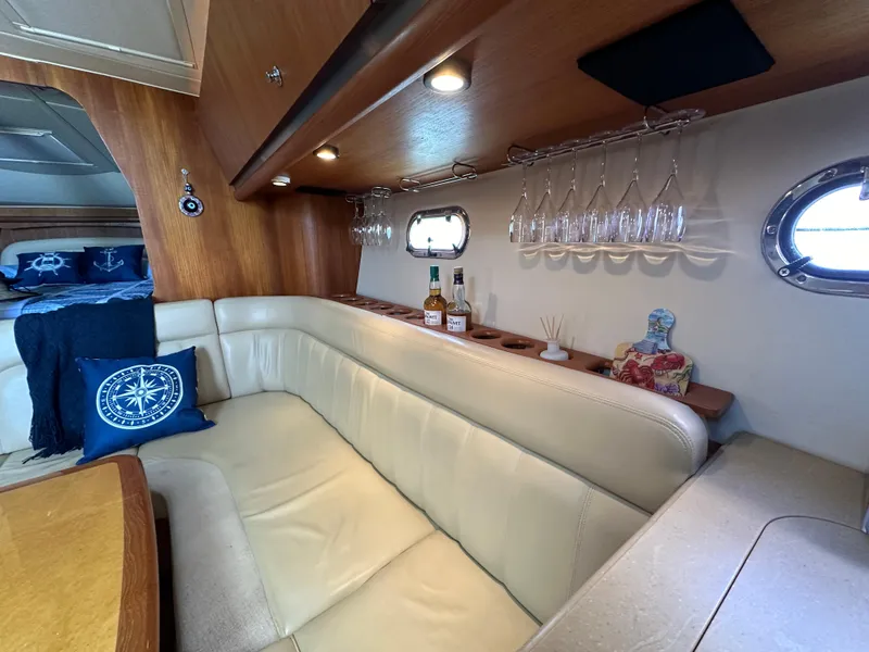 Slide: The Image of Luxurious interior of 2004 Tiara Yachts 3600 Sovran with leather seating and bar area. - 18