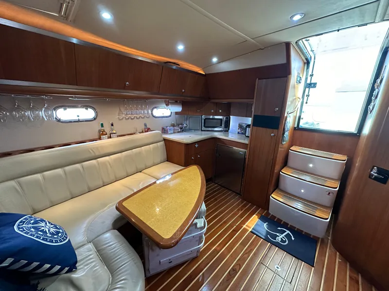 Slide: The Image of 2004 Tiara Yachts 3600 Sovran interior with kitchen and seating area - 21