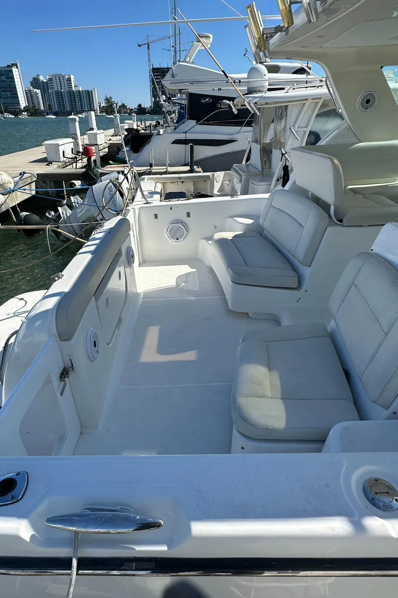 Slide: The Image of 2004 Tiara Yachts 3600 Sovran docked, featuring spacious seating and modern design. - 28