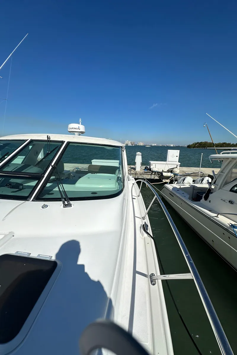 Slide: The Image of 2004 Tiara Yachts 3600 Sovran docked at a marina on a sunny day. - 30