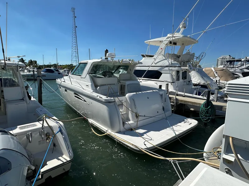 Slide: The Image of 2004 Tiara Yachts 3600 Sovran docked at a marina on a sunny day. - 4