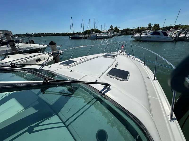 Slide: The Image of 2004 Tiara Yachts 3600 Sovran docked at a marina on a sunny day. - 7