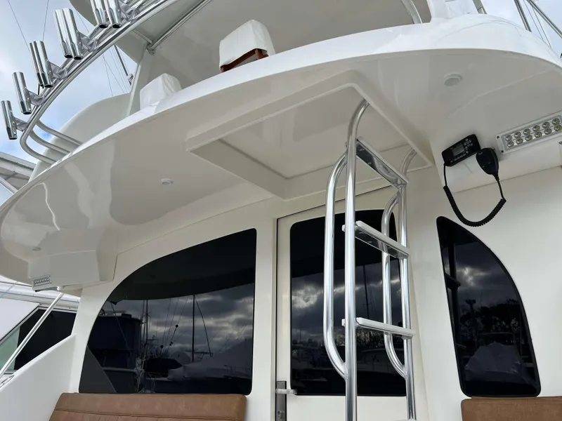 Slide: The Image of Henriques 50 Sportfisherman 2021, rear view with ladder and seating area. - 12