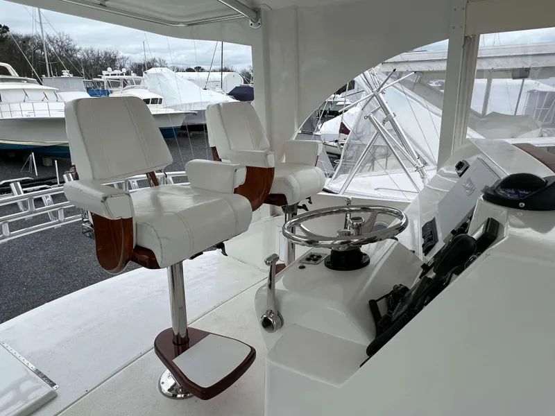 Slide: The Image of 2021 Henriques 50 Sportfisherman helm with dual captain's chairs and steering wheel. - 14